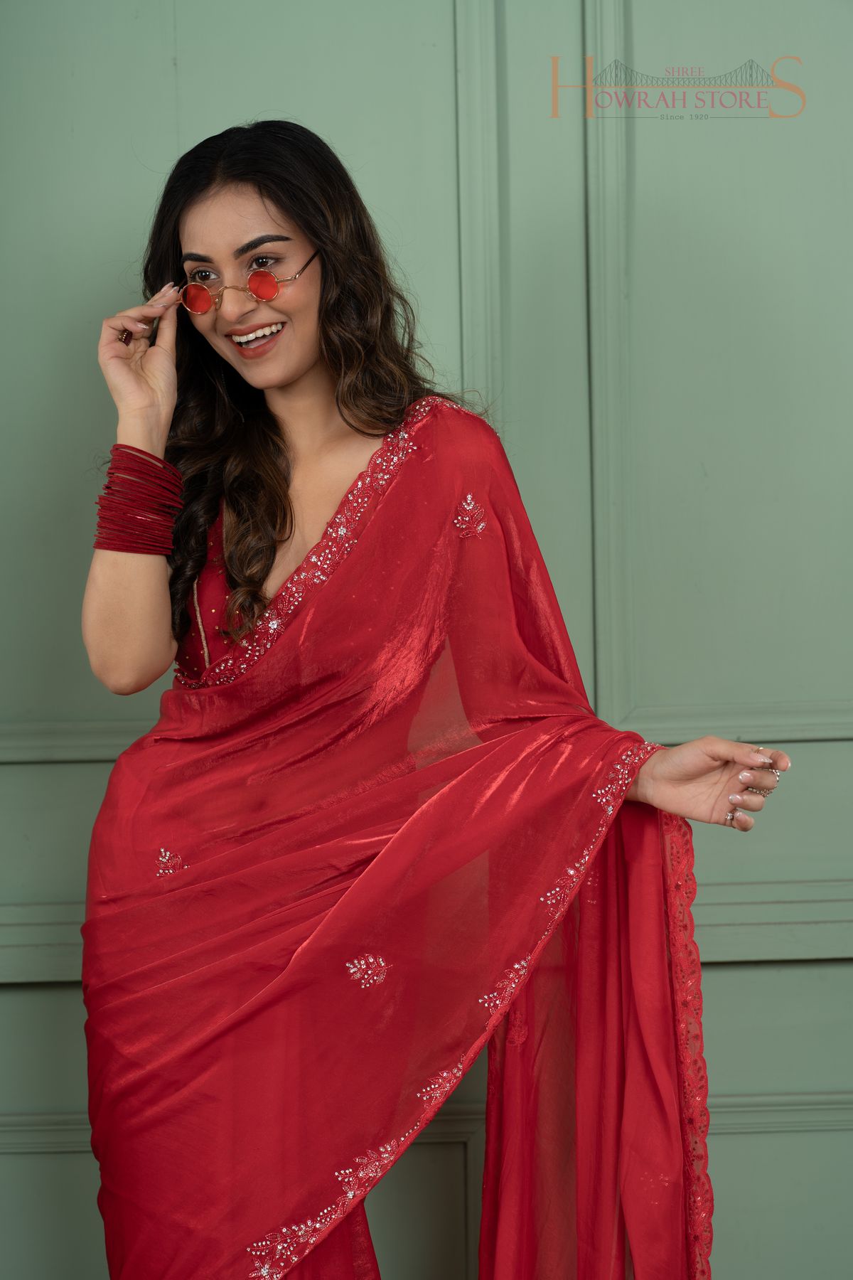 A model wearing a saree from Shree Howrah's Trending Sarees